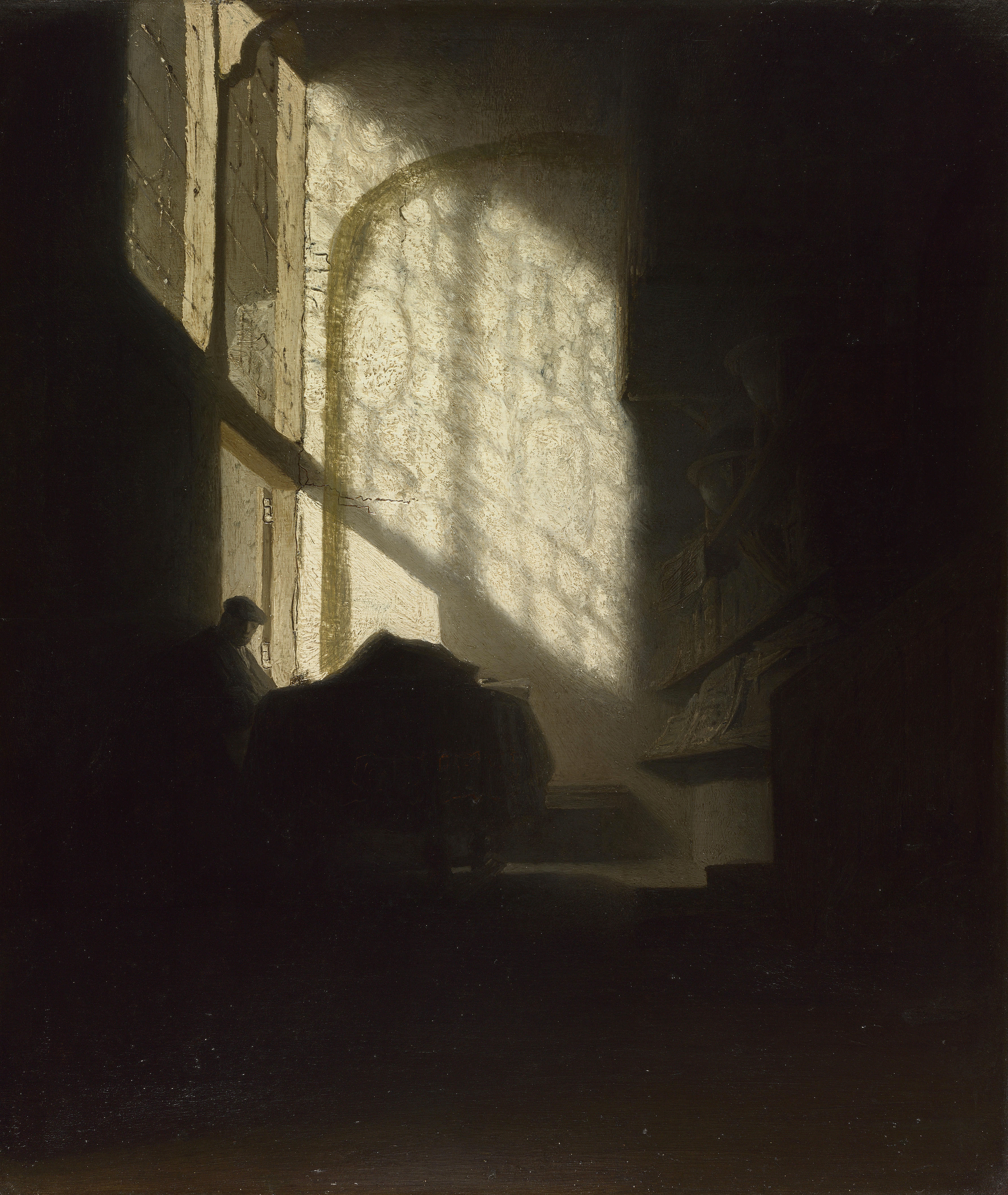 1629 A Man seated reading at a Table in a Lofty Room.jpg